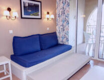 a blue and white bed in a room